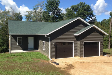 Elegant vinyl exterior home photo in Other