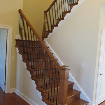 Foyer U-Shaped Staircase With Craftsman Newel Post
