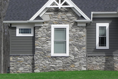Example of an arts and crafts exterior home design in New York