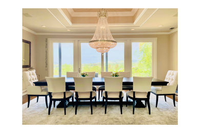 Example of a mid-sized transitional medium tone wood floor, brown floor and vaulted ceiling kitchen/dining room combo design in Los Angeles with beige walls