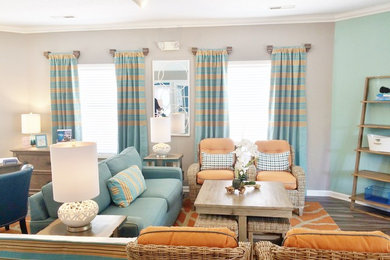 Inspiration for a small coastal open concept laminate floor and brown floor living room remodel in Other with gray walls