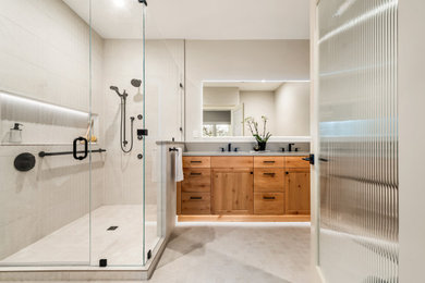 Inspiration for a large contemporary shower room bathroom in Portland with shaker cabinets, light wood cabinets, a two-piece toilet, porcelain tiles, white walls, a submerged sink, engineered stone worktops, white floors, a hinged door, white worktops, double sinks and a built in vanity unit.