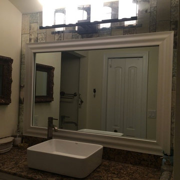 Bathroom redo with framed mirror and antique mirror tiles