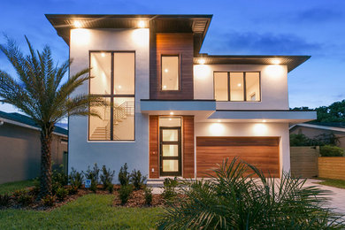 Contemporary two-storey white house exterior in Orlando with mixed siding and a flat roof.