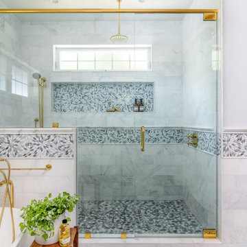 Custom Marble Walk-In Shower with Brass Fixtures in San Diego