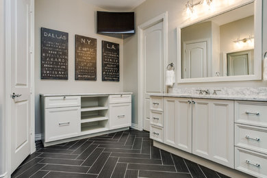 Inspiration for a black and white tile and stone tile claw-foot bathtub remodel in Dallas with marble countertops and white cabinets