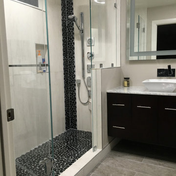 New walk in shower with rainfall shower head and body jets with custom tile work