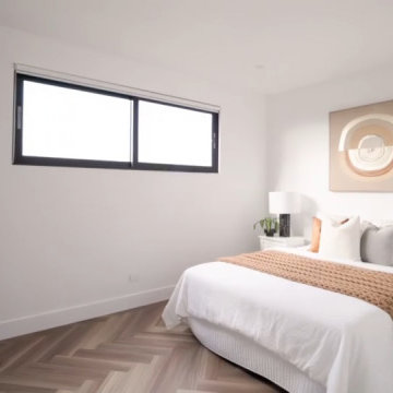 Calm Neutral Guest Bedroom With Horizontal High Windows