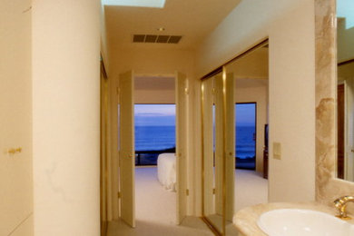 Example of a large trendy marble floor bathroom design in San Francisco with a drop-in sink