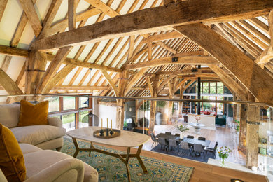 This is an example of an expansive bohemian living room in Hampshire.