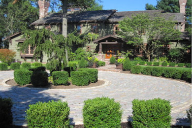 Inspiration for a mid-sized traditional partial sun front yard brick driveway in Philadelphia.