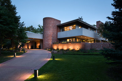 Inspiration for a huge contemporary red three-story concrete exterior home remodel in Denver