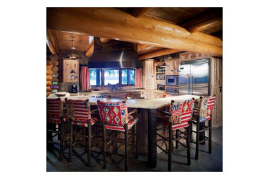 Inspiration for a large timeless travertine floor eat-in kitchen remodel in Wichita with an undermount sink, distressed cabinets, limestone countertops, beige backsplash, stone tile backsplash, stainless steel appliances and an island