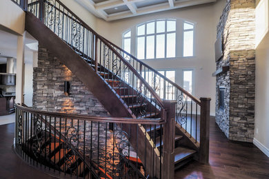 Mid-sized elegant wooden curved open staircase photo in Edmonton