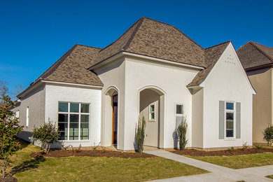 Example of a trendy white exterior home design in New Orleans