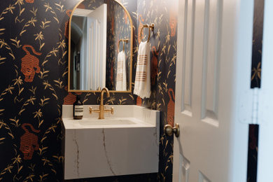 Example of an eclectic powder room design in Dallas