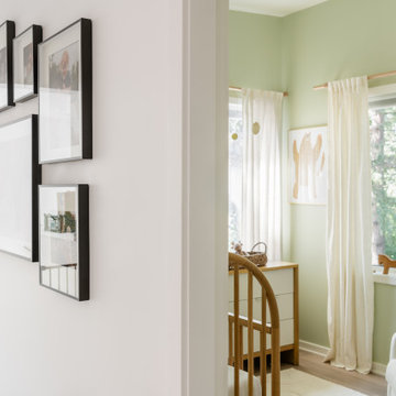 Nursery Entry with Gallery Wall and Soft Green Palette – Woodland Nursery Design