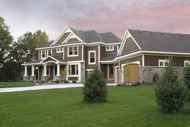 Large traditional brown two-story wood exterior home idea in Minneapolis with a hip roof and a shingle roof
