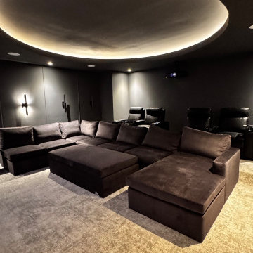 The Midnight Dome - Modern Black Home Theater with Coved Ceiling & Pit Sectional