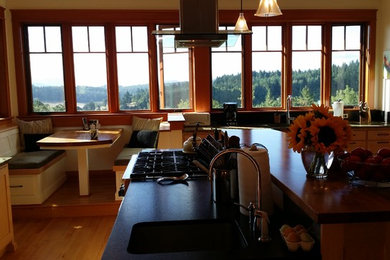 Example of a large trendy l-shaped medium tone wood floor kitchen design in Other with a single-bowl sink, shaker cabinets, medium tone wood cabinets, granite countertops and metallic backsplash