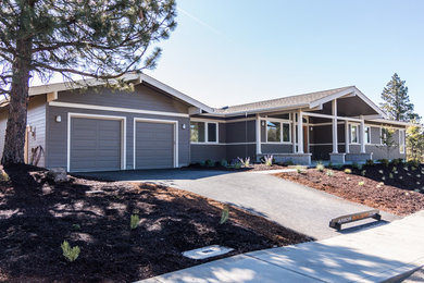 Mid-sized elegant gray one-story exterior home photo in Other