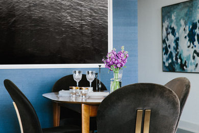 This is an example of a small contemporary dining room in San Francisco with blue walls.