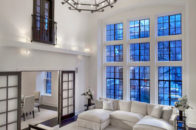 Example of a large classic formal and open concept dark wood floor living room design in Chicago with white walls, a standard fireplace, a stone fireplace and no tv