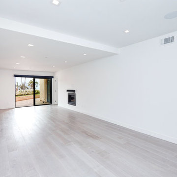 Living Room With Corner Fireplace and Ocean Ave View