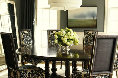 Example of a classic dark wood floor dining room design in New York with gray walls