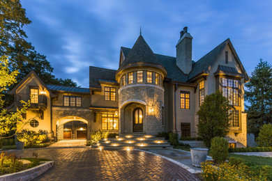 Example of a french country exterior home design in Milwaukee