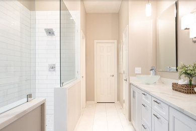 Inspiration for a small contemporary master white tile and ceramic tile porcelain tile bathroom remodel in Indianapolis with shaker cabinets, white cabinets, gray walls, a vessel sink and quartz countertops