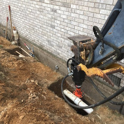 Foundation repair, driving helical to the proper depth - Products