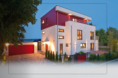 Inspiration for a large craftsman red three-story concrete exterior home remodel in Calgary