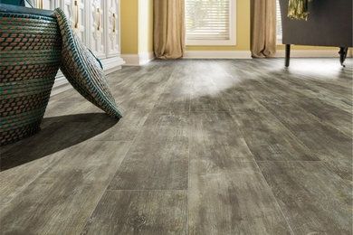 Inspiration for a mid-sized contemporary formal and open concept vinyl floor and brown floor living room remodel in DC Metro with white walls, no fireplace and no tv