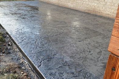Example of a mid-sized backyard concrete patio design in Other