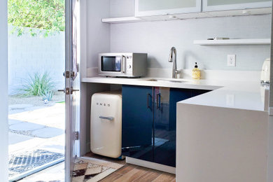 Example of a small l-shaped ceramic tile open concept kitchen design in Phoenix with an undermount sink, blue cabinets, no island and white countertops