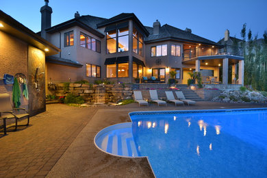 Inspiration for a transitional pool in Edmonton.