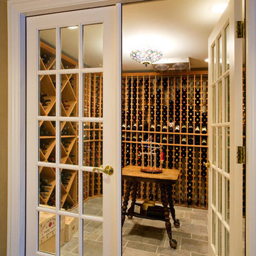 Wine Cellar with Porcelain Tile Floors and Fully Bound French Doors