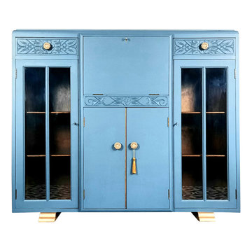 This pretty bureau was refinished in blue, with touches of gold.