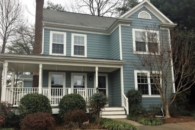 Example of a mid-sized beach style blue two-story concrete fiberboard gable roof design in Other