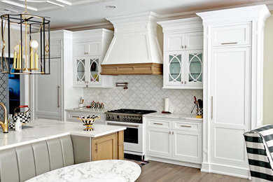 Design ideas for a large traditional u-shaped kitchen/diner in New York with a built-in sink, shaker cabinets, white cabinets, engineered stone countertops, white splashback, engineered quartz splashback, white appliances, medium hardwood flooring, an island, brown floors, white worktops and a coffered ceiling.