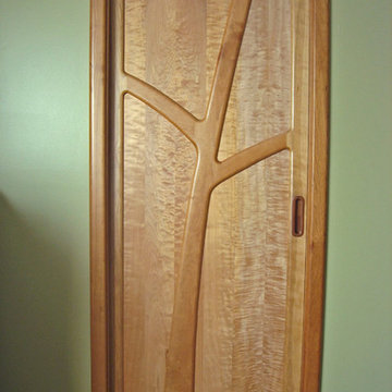 Cherry and curly maple sliding pocket door