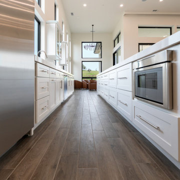 Modern White Shaker Kitchen with Oversized Island & Custom Storage Solutions