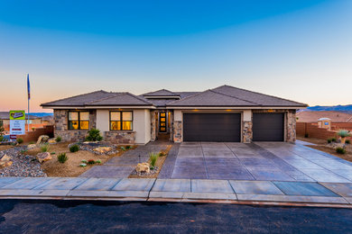 Large contemporary beige one-story mixed siding exterior home idea in Salt Lake City with a hip roof