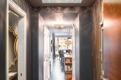 Inspiration for a mid-sized contemporary dark wood floor and brown floor hallway remodel in Seattle with gray walls