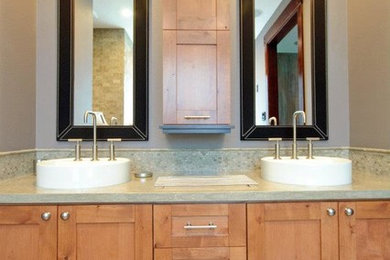 Freestanding bathtub - mid-sized transitional master multicolored tile and stone tile slate floor freestanding bathtub idea in Los Angeles with a vessel sink, shaker cabinets, light wood cabinets, quartz countertops, a one-piece toilet and brown walls