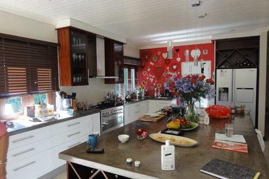 Example of a minimalist kitchen design in Other