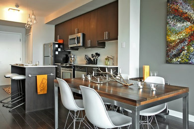 Small contemporary kitchen/dining combo in Toronto with grey walls and dark hardwood floors.