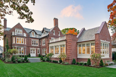 Inspiration for a timeless red three-story brick exterior home remodel in Boston