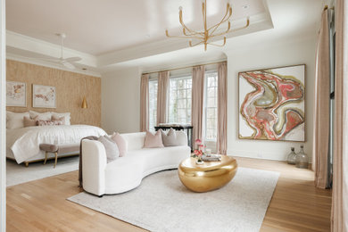 Example of a transitional light wood floor, beige floor and tray ceiling bedroom design in Other with beige walls